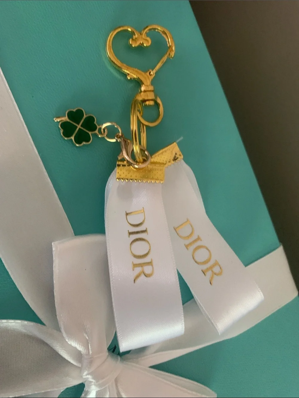 DIOR White Ribbon Key Ring with Gold & Green Clover Charm